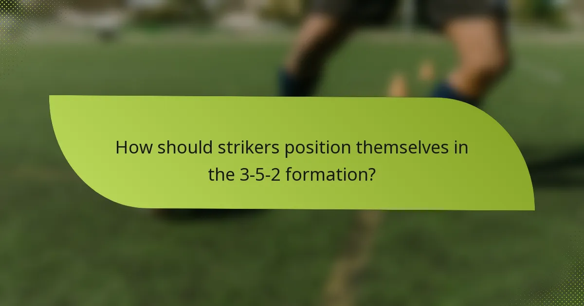 How should strikers position themselves in the 3-5-2 formation?